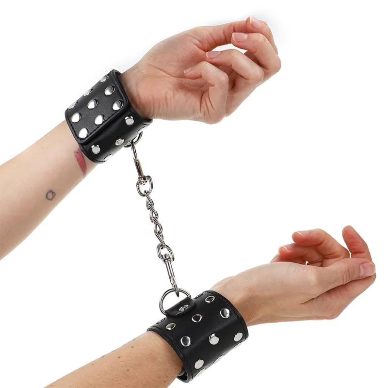 Kink - Wrist Restraints with Snap Fasten Full of Rivets Black Adjustable 19-24 cm X 5.5 cm